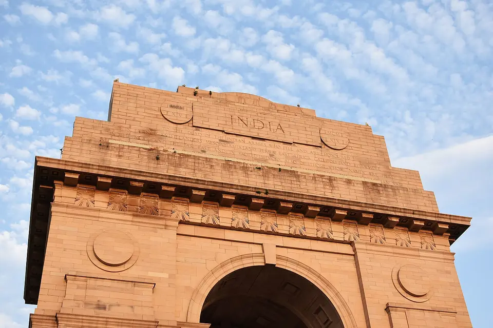 India Gate in New Delhi against a sky of small white clouds