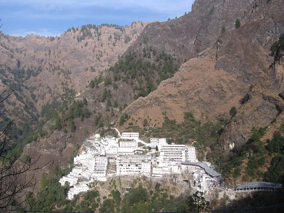 The white buildings of the Vaishno Devi Bhawan on the mountainside above Katra