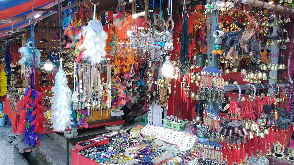 A market stall in McLeodganj hung with bright prayer beads, charms and dreamcatchers