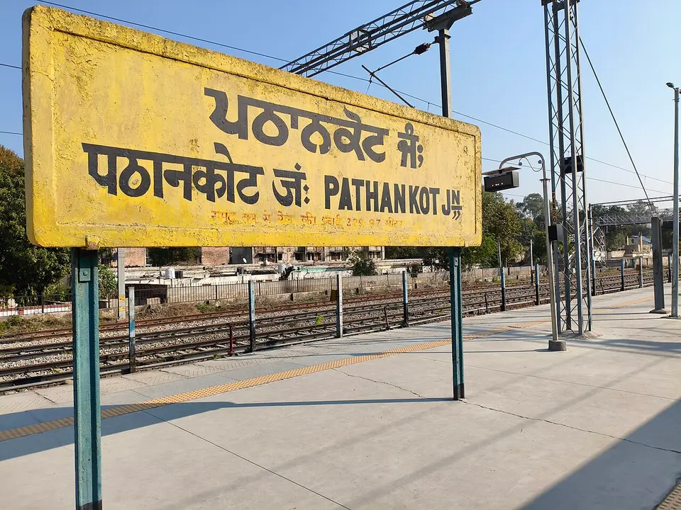 The station sign on the platform at Pathankot Junction, in Punjabi, Hindi and English