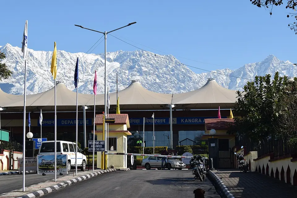 The terminal at Kangra airport, Gaggal, with the snow-covered Dhauladhar behind it