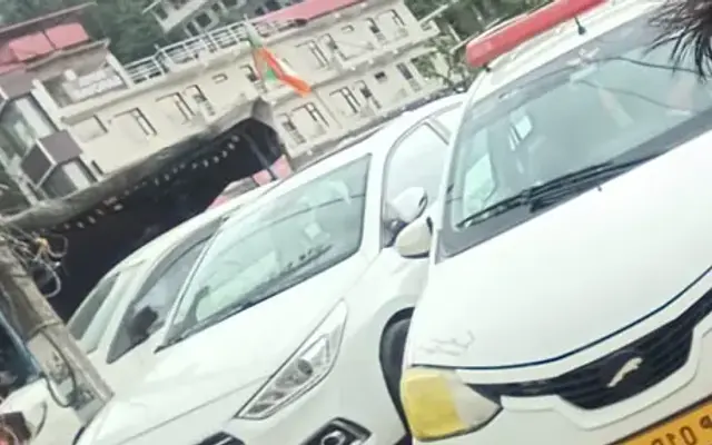 Baglamukhi Travels tourist-taxi sedans (Etios / Swift Dzire) parked at Kangra